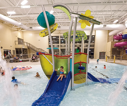 Kids playing on HydraHub water park playground equipment