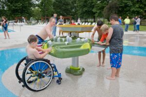 Children playing at AquaGather Station at Parkersburg City Park