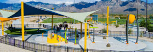 Naranja Park splash pad hero image with mountains in the background