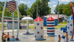 Stars and striped theme-painted splash pad by Aquatix