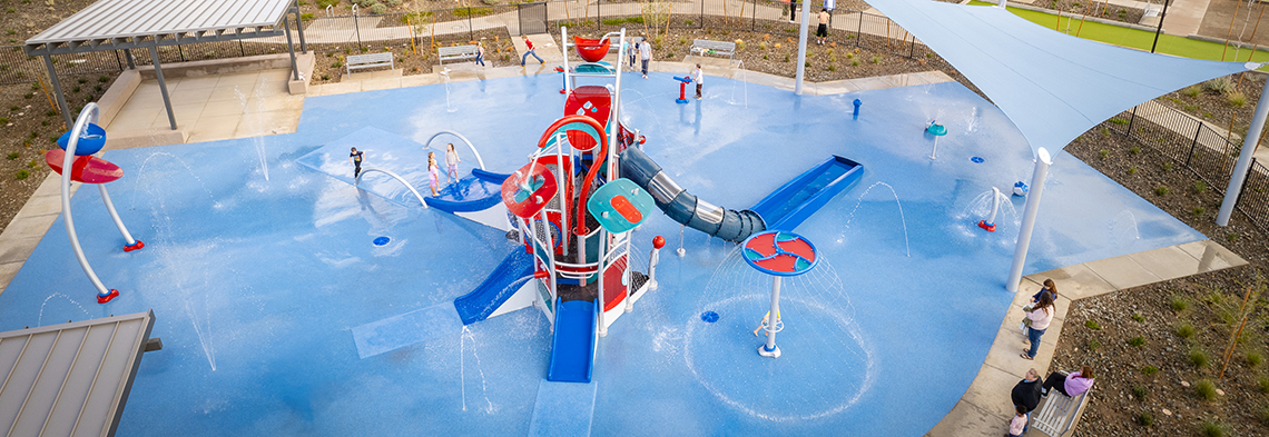 Wide angle aerial shot of splash pad at Radiance at Superstition Vistas