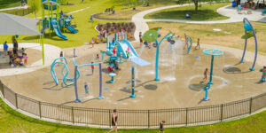 Aerial view of Aquatix splash pad with water slide, tall dumping buckets and more