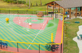 Landscape image of a splash pad designed to look like a baseball diamond