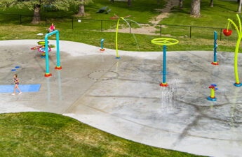 Wide shot of Conrad Spray Park in Conrad, Montana