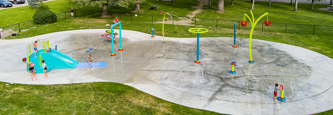 Wide shot of Conrad Spray Park in Conrad, Montana